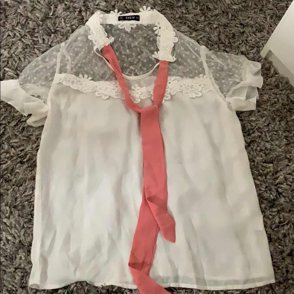 White blouse with a pink front tie